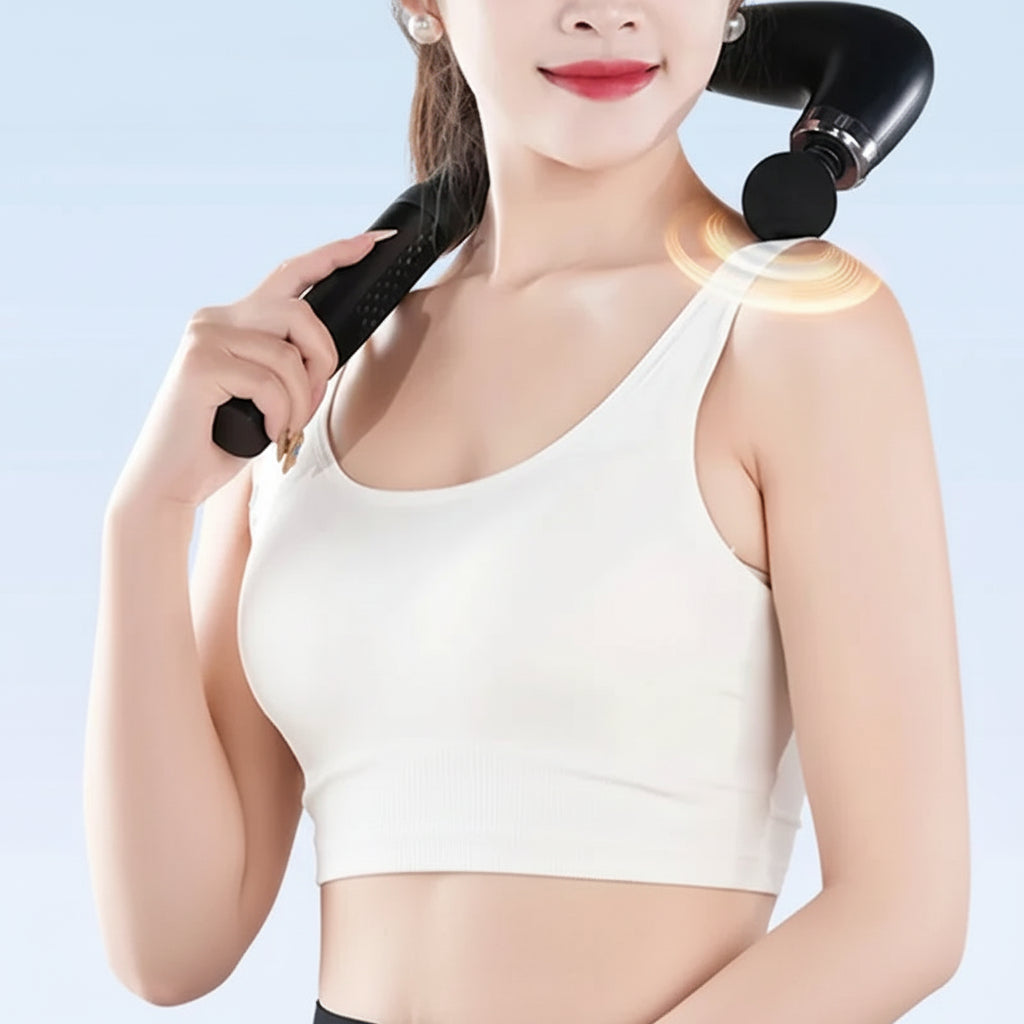 Woman using handheld shoulder massage device from The Relief Method for deep relaxation