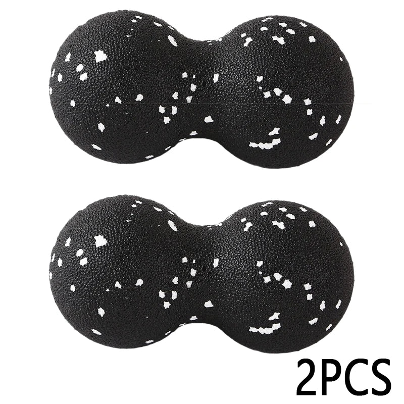 Set of two black double lacrosse massage balls with white speckles for muscle relief