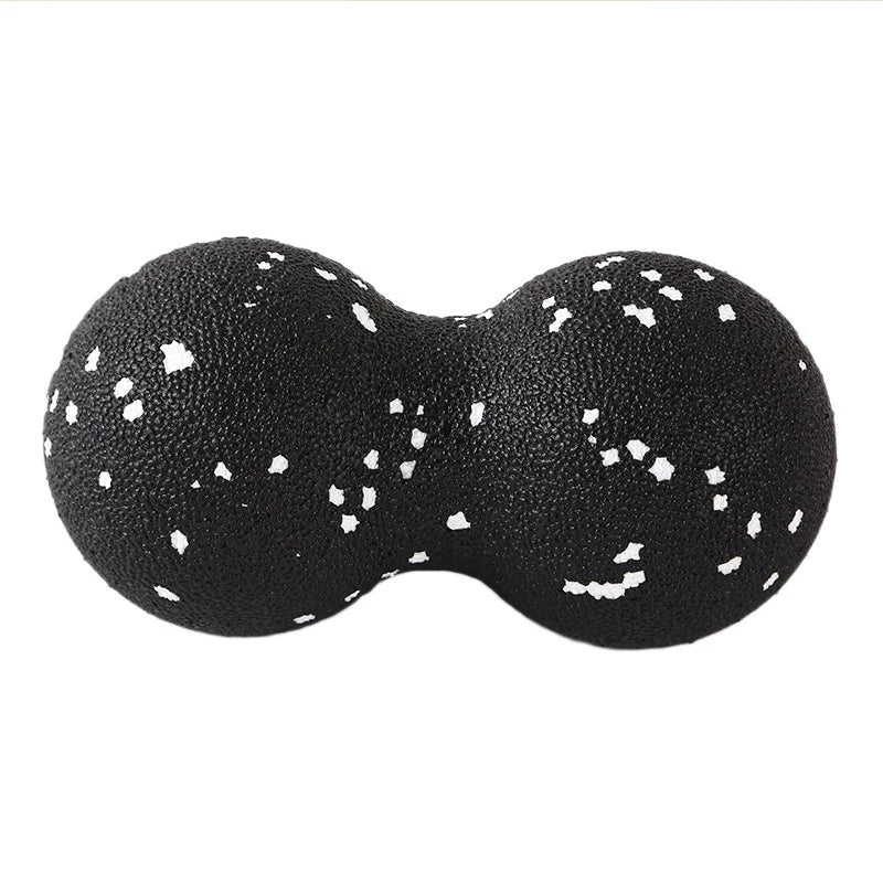 Black double lacrosse massage ball with white speckles for muscle relief, The Relief Method