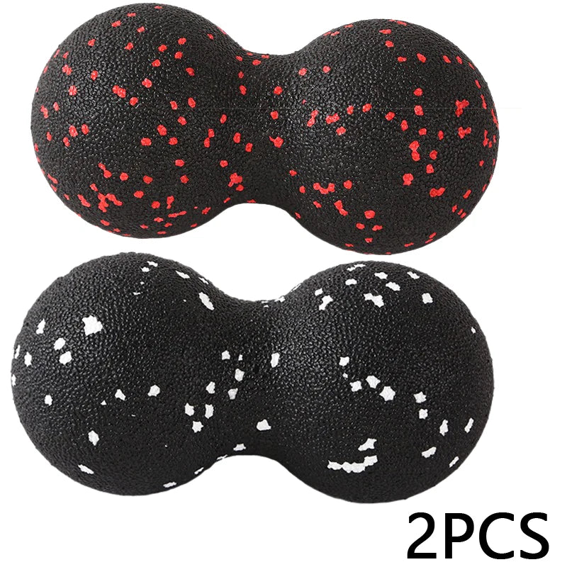 Pair of black peanut massage balls with red and white speckles for muscle relief, 2 pieces